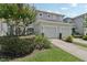 Charming townhome with a two-car garage, a well-manicured lawn, and curb appeal at 2337 Bexley Pl, Casselberry, FL 32707