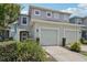 Charming townhome with a two-car garage, a well-manicured lawn, and curb appeal at 2337 Bexley Pl, Casselberry, FL 32707