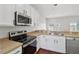 Well-lit kitchen with stainless steel appliances and ample countertop space for cooking at 2337 Bexley Pl, Casselberry, FL 32707