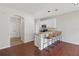 Bright kitchen with white cabinetry, a breakfast bar, and hardwood floors at 2337 Bexley Pl, Casselberry, FL 32707