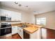 Kitchen area featuring stainless steel appliances, breakfast bar and recessed lights at 2337 Bexley Pl, Casselberry, FL 32707