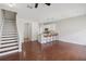 Open floor plan with breakfast bar, stairs and hardwood flooring at 2337 Bexley Pl, Casselberry, FL 32707