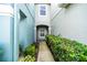 Walkway leading to entrance flanked by lush green bushes at 2337 Bexley Pl, Casselberry, FL 32707