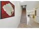 Hallway with staircase and view to kitchen at 2409 Silver Palm Dr, Kissimmee, FL 34747