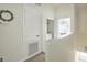 Upstairs hallway with easy access to the laundry closet, offering convenience and functionality at 2409 Silver Palm Dr, Kissimmee, FL 34747