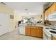 Bright kitchen with bar and view to living area at 2409 Silver Palm Dr, Kissimmee, FL 34747