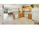 Bright kitchen with white appliances and tile flooring at 2409 Silver Palm Dr, Kissimmee, FL 34747
