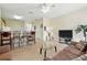 Spacious living room with a kitchen view, ideal for hosting guests and enjoying open living at 2409 Silver Palm Dr, Kissimmee, FL 34747