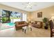 Cozy living room overlooking the pool with comfortable seating and tile flooring at 2409 Silver Palm Dr, Kissimmee, FL 34747