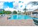 Large swimming pool with lounge chairs, palm trees, and clear blue water for relaxation at 2409 Silver Palm Dr, Kissimmee, FL 34747
