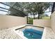 A screened pool with a brick deck, enclosed for privacy and relaxation at 2409 Silver Palm Dr, Kissimmee, FL 34747