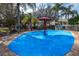Vibrant splash pad with colorful features and safe, soft surface for to enjoy at 2409 Silver Palm Dr, Kissimmee, FL 34747