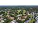 Aerial view of townhome community showing its proximity to a park and neighborhoods at 271 Raintree Dr, Casselberry, FL 32707