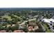 Aerial view of townhomes neighborhood nestled amidst lush green trees and landscaping at 271 Raintree Dr, Casselberry, FL 32707