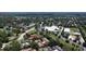 Overhead view of community with mature trees with buildings in background at 271 Raintree Dr, Casselberry, FL 32707