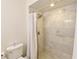 Bright bathroom showcasing a tiled walk-in shower with glass doors and modern fixtures at 271 Raintree Dr, Casselberry, FL 32707