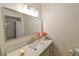 Well-lit bathroom with a large mirror, modern vanity, and fresh decor at 271 Raintree Dr, Casselberry, FL 32707