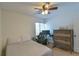 Spacious bedroom with a bed, desk, and plenty of natural light at 271 Raintree Dr, Casselberry, FL 32707