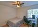Bright bedroom featuring a desk, comfortable chair, and natural light at 271 Raintree Dr, Casselberry, FL 32707