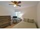 Cozy bedroom featuring a bed, desk, and natural light from the window at 271 Raintree Dr, Casselberry, FL 32707