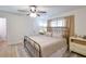 Charming bedroom with a brass bed frame, soft lighting, and neutral decor at 271 Raintree Dr, Casselberry, FL 32707