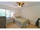 Cozy bedroom with natural light, wood floors, and neutral tones at 271 Raintree Dr, Casselberry, FL 32707