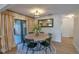 This dining room has hardwood floors, an area rug and plenty of light at 271 Raintree Dr, Casselberry, FL 32707