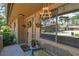 Inviting front porch with seating, decorative accents and nice curb appeal at 271 Raintree Dr, Casselberry, FL 32707