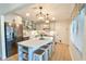 This kitchen features a large island, stainless steel appliances, and updated cabinets at 271 Raintree Dr, Casselberry, FL 32707