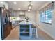 This kitchen features a large island, stainless steel appliances, and updated cabinets at 271 Raintree Dr, Casselberry, FL 32707