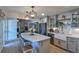 This kitchen features a large island, stainless steel appliances, and updated cabinets at 271 Raintree Dr, Casselberry, FL 32707
