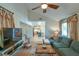 Cozy living room with vaulted ceilings, plush seating, and plenty of natural light at 271 Raintree Dr, Casselberry, FL 32707