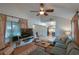 Cozy living room with vaulted ceilings, plush seating, and plenty of natural light at 271 Raintree Dr, Casselberry, FL 32707