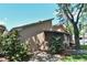 A cozy screened-in porch and well-maintained landscaping create a private outdoor living space at 271 Raintree Dr, Casselberry, FL 32707