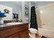 Functional bathroom with blue walls and a shower with a decorative curtain at 2733 Big Timber Dr, Kissimmee, FL 34758