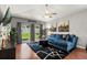 Comfortable living room with hardwood floors and sliding glass doors to the backyard at 2733 Big Timber Dr, Kissimmee, FL 34758