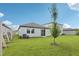 Beautiful green backyard with healthy grass and a partial fence at 2770 Virginia Pine Dr, Bartow, FL 33830