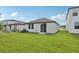 Wide view of backyard with fresh grass and a patio at 2770 Virginia Pine Dr, Bartow, FL 33830