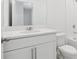 Bathroom features a modern vanity, sink, mirror, toilet, and bath with shower at 2770 Virginia Pine Dr, Bartow, FL 33830