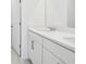 Bathroom with double vanity with white cabinets and light countertops at 2770 Virginia Pine Dr, Bartow, FL 33830