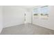 Bright bedroom features carpeting, natural light, and access to backyard at 2770 Virginia Pine Dr, Bartow, FL 33830