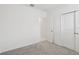 Bright, carpeted bedroom with a door to the bathroom and a closet at 2770 Virginia Pine Dr, Bartow, FL 33830