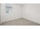 Bright, carpeted bedroom with a window, and neutral walls at 2770 Virginia Pine Dr, Bartow, FL 33830