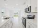 Modern kitchen with stainless steel appliances and a view of the backyard at 2770 Virginia Pine Dr, Bartow, FL 33830