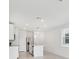Bright open kitchen features stainless steel appliances and a center island with a sink at 2770 Virginia Pine Dr, Bartow, FL 33830