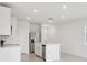 Bright open kitchen features stainless steel appliances and a center island with a sink at 2770 Virginia Pine Dr, Bartow, FL 33830