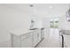 Modern kitchen with island, stainless steel appliances, and view of the backyard at 2770 Virginia Pine Dr, Bartow, FL 33830