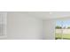 Well-lit living room featuring access to backyard through glass sliding doors at 2770 Virginia Pine Dr, Bartow, FL 33830
