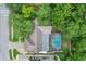 Aerial view of the home showcasing the roof, pool, yard, and neighborhood at 283 Haverclub Ct, Longwood, FL 32779