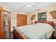 Bright bedroom features a ceiling fan, closet and unique wall decor at 283 Haverclub Ct, Longwood, FL 32779